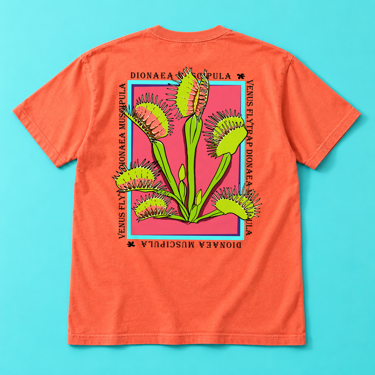 Coral-colored Venus Flytrap graphic tee, back view with green botanical artwork on a turquoise background.